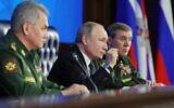 Russian President Vladimir Putin (C) and Russian Defense Minister Sergei Shoigu (L) take part in the annual meeting of the Defense Ministry board, in Moscow on December 24, 2019. (Mikhail Klimentyev/Sputnik/AFP)
