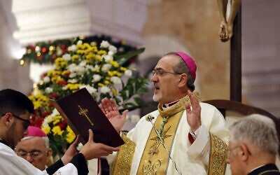 The acting Latin Patriarch of Jerusalem Pierbattista Pizzaballa leads a Christmas midnight mass in the Church of the Nativity, in Bethlehem in the West Bank, December 25, 2019. (MUSSA ISSA QAWASMA/POOL/AFP)