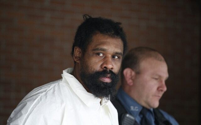Suspect in Hanukkah celebration stabbings Grafton Thomas, 37, from Greenwood Lake, leaves the Ramapo Town Hall in Airmont, New York after being arrested on December 29, 2019. (Kena Betancur/AFP) Suspect in Hanukkah celebration stabbings Grafton Thomas, 37, from Greenwood Lake, leaves the Ramapo Town Hall in Airmont, New York after being arrested on December 29, 2019. (Kena Betancur/AFP)