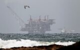 The platform of the Leviathan natural gas field in the Mediterranean Sea, pictured from Israel's northern beach of Dor on December 31, 2019. (Jack Guez/AFP)