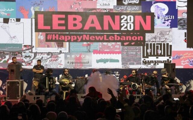 Lebanese band "The Great Departed" performs during new year's celebrations in downtown Beirut on December 31, 2019. (Anwar Amro/AFP) Lebanese band "The Great Departed" performs during new year's celebrations in downtown Beirut on December 31, 2019. (Anwar Amro/AFP)