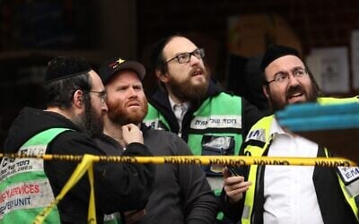 JERSEY CITY, NJ - DECEMBER 11: Recovery and clean up crews work the scene in the aftermath of a mass shooting at the JC Kosher Supermarket on December 11, 2019 in Jersey City, New Jersey. Six people, including a Jersey City police officer and three civilians were killed in a deadly, hours-long gun battle between two armed suspects and police on Tuesday in a standoff and shootout in a Jewish market that appears to have been targeted, according to Jersey City Mayor Steven Fulop.   Rick Loomis/Getty Images/AFP
