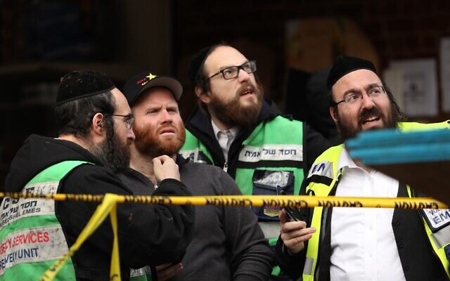 JERSEY CITY, NJ - DECEMBER 11: Recovery and clean up crews work the scene in the aftermath of a mass shooting at the JC Kosher Supermarket on December 11, 2019 in Jersey City, New Jersey. Six people, including a Jersey City police officer and three civilians were killed in a deadly, hours-long gun battle between two armed suspects and police on Tuesday in a standoff and shootout in a Jewish market that appears to have been targeted, according to Jersey City Mayor Steven Fulop. Rick Loomis/Getty Images/AFP JERSEY CITY, NJ - DECEMBER 11: Recovery and clean up crews work the scene in the aftermath of a mass shooting at the JC Kosher Supermarket on December 11, 2019 in Jersey City, New Jersey. Six people, including a Jersey City police officer and three civilians were killed in a deadly, hours-long gun battle between two armed suspects and police on Tuesday in a standoff and shootout in a Jewish market that appears to have been targeted, according to Jersey City Mayor Steven Fulop. Rick Loomis/Getty Images/AFP
