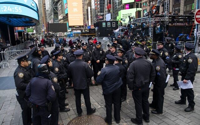 NYPD officers are briefed as people arrive to celebrate New Years eve in Times Square on December 31, 2019, in New York City. (Eduardo Munoz Alvarez/Getty Images/AFP) NYPD officers are briefed as people arrive to celebrate New Years eve in Times Square on December 31, 2019, in New York City. (Eduardo Munoz Alvarez/Getty Images/AFP)