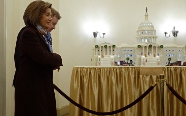 Speaker of the House Nancy Pelosi (D-CA) walks past a gingerbread model of the U.S. Capitol as she arrives at the capitol along side her Press Secretary Drew Hammill December 18, 2019 in Washington, DC. The House is scheduled to vote on two articles of impeachment against President Donald Trump later in the day. (Chip Somodevilla/Getty Images/AFP) Speaker of the House Nancy Pelosi (D-CA) walks past a gingerbread model of the U.S. Capitol as she arrives at the capitol along side her Press Secretary Drew Hammill December 18, 2019 in Washington, DC. The House is scheduled to vote on two articles of impeachment against President Donald Trump later in the day. (Chip Somodevilla/Getty Images/AFP)