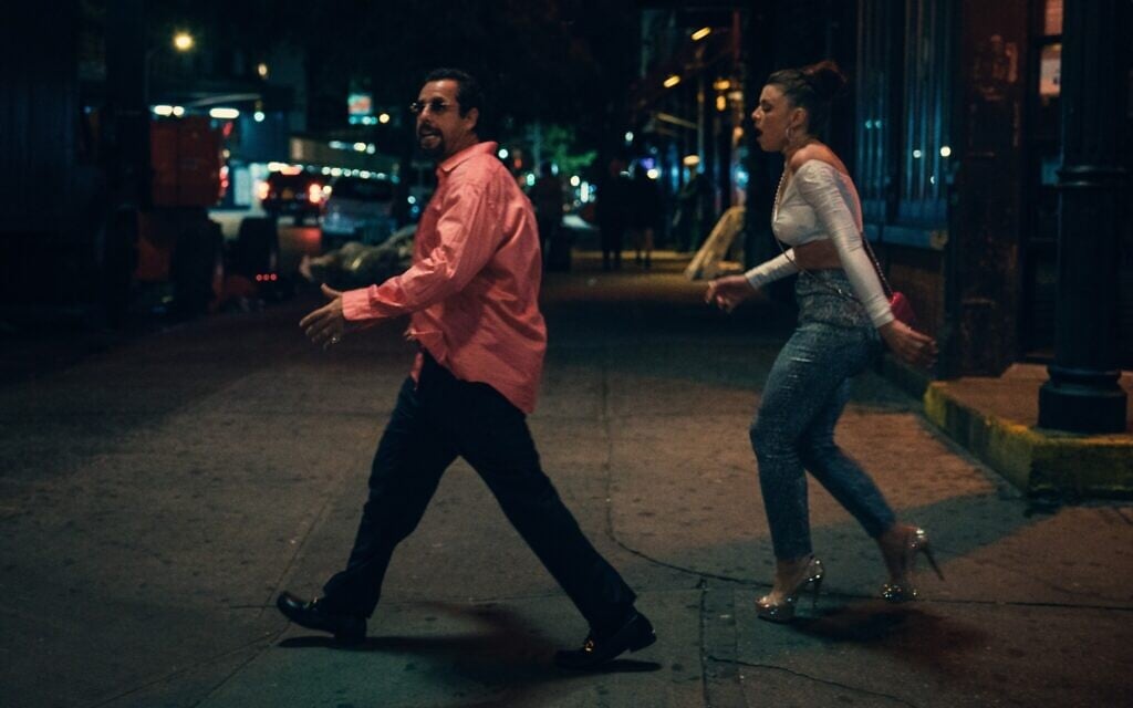 Adam Sandler as Howard Ratner and Julia Fox as Julia in 'Uncut Gems,' by Josh and Benny Safdie. (Courtesy)