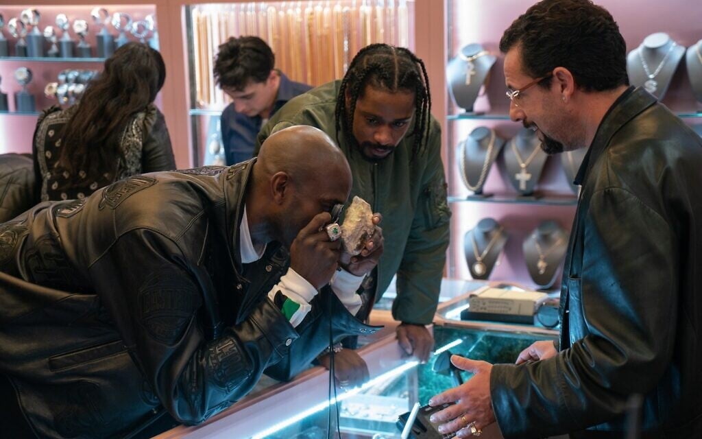 NBA star Kevin Garnett, left, plays himself in 'Uncut Gems,' by Josh and Benny Safdie, along with The Weeknd, center, and Adam Sandler. (Courtesy)