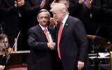 President Donald Trump is greeted by Pastor Robert Jeffress at the Celebrate Freedom Rally at the John F. Kennedy Center for the Performing Arts in Washington, July 1, 2017. (Olivier Douliery/Pool/ Getty Images via JTA)