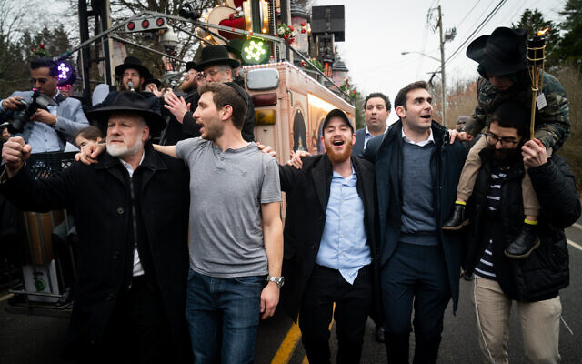 Revelers celebrate a new Torah scroll in Monsey, New York, December 29, 2019. (Luke Tress/Times of Israel)