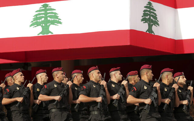 Lebanese marine special forces soldiers march during a military parade to mark the 76th anniversary of Lebanon's independence from France at the Lebanese Defense Ministry, in Yarzeh near Beirut, Lebanon, November 22, 2019. (Hassan Ammar/AP) Lebanese marine special forces soldiers march during a military parade to mark the 76th anniversary of Lebanon's independence from France at the Lebanese Defense Ministry, in Yarzeh near Beirut, Lebanon, November 22, 2019. (Hassan Ammar/AP)