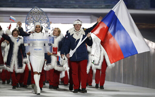 Alexander Zubkov of Russia carries the national flag as he leads the team during the opening ceremony of the 2014 Winter Olympics in Sochi, Russia, February 7, 2014. (AP Photo/Mark Humphrey, file) Alexander Zubkov of Russia carries the national flag as he leads the team during the opening ceremony of the 2014 Winter Olympics in Sochi, Russia, February 7, 2014. (AP Photo/Mark Humphrey, file)