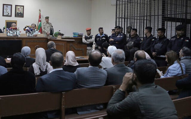 Israeli Konstantin Kotov stands in the defendant's cage during an appearance before a state security court where he was charged with illegally entering the country and possessing drugs, in Amman, Jordan, Monday Dec. 2, 2019. (AP Photo/Raad Adayleh) Israeli Konstantin Kotov stands in the defendant's cage during an appearance before a state security court where he was charged with illegally entering the country and possessing drugs, in Amman, Jordan, Monday Dec. 2, 2019. (AP Photo/Raad Adayleh)