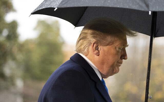 US President Donald Trump walks to Marine One after speaking with reporters on the South Lawn of the White House before departing, December 2, 2019, in Washington. (AP Photo/Alex Brandon) US President Donald Trump walks to Marine One after speaking with reporters on the South Lawn of the White House before departing, December 2, 2019, in Washington. (AP Photo/Alex Brandon)