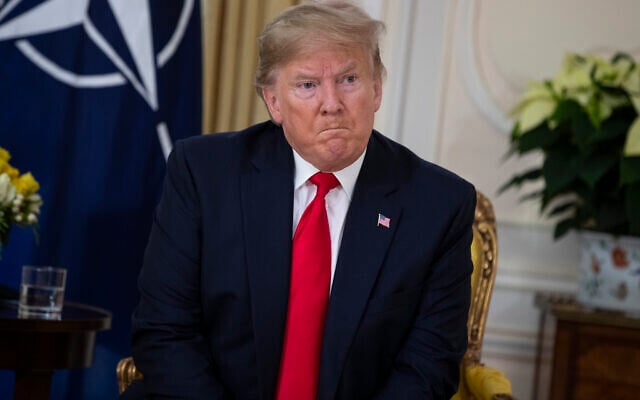 US President Donald Trump speaks during a meeting with NATO Secretary General, Jens Stoltenberg at Winfield House in London, December 3, 2019. (AP Photo/Evan Vucci) US President Donald Trump speaks during a meeting with NATO Secretary General, Jens Stoltenberg at Winfield House in London, December 3, 2019. (AP Photo/Evan Vucci)