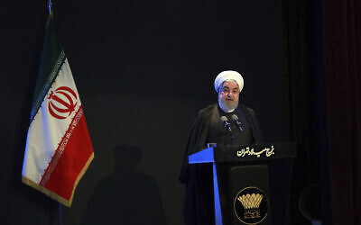 In this photo released by the official website of the Office of the Iranian Presidency, President Hassan Rouhani speaks in a meeting in Tehran, Iran, December 4, 2019. (Iranian Presidency Office via AP)