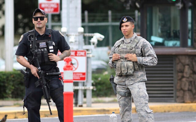 Security stands guard outside the main gate at Joint Base Pearl Harbor-Hickam, in Hawaii, Wednesday, Dec. 4, 2019. (AP Photo/Caleb Jones) Security stands guard outside the main gate at Joint Base Pearl Harbor-Hickam, in Hawaii, Wednesday, Dec. 4, 2019. (AP Photo/Caleb Jones)