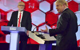 Opposition Labour Party leader Jeremy Corbyn, left, and British Prime Minister Boris Johnson, during a head to head live Election Debate at the BBC TV studios in Maidstone, England,  December 6, 2019. ( Jeff Overs/BBC via AP)