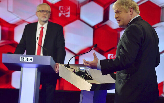 Opposition Labour Party leader Jeremy Corbyn, left, and British Prime Minister Boris Johnson, during a head to head live Election Debate at the BBC TV studios in Maidstone, England, December 6, 2019. ( Jeff Overs/BBC via AP) Opposition Labour Party leader Jeremy Corbyn, left, and British Prime Minister Boris Johnson, during a head to head live Election Debate at the BBC TV studios in Maidstone, England, December 6, 2019. ( Jeff Overs/BBC via AP)