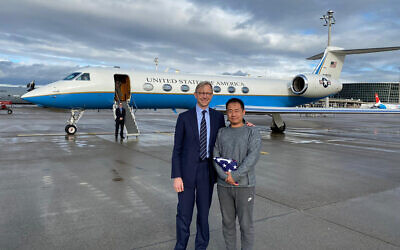 US special representative for Iran Brian Hook stands with Xiyue Wang in Zurich, Switzerland on December 7, 2019.  (US State Department via AP)