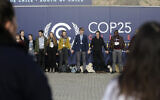 Young activists from the 'Fridays For Future' climate protest Movement form a human chain at the COP25 Climate summit in Madrid, Spain, December 9, 2019. (Andrea Comas/AP)
