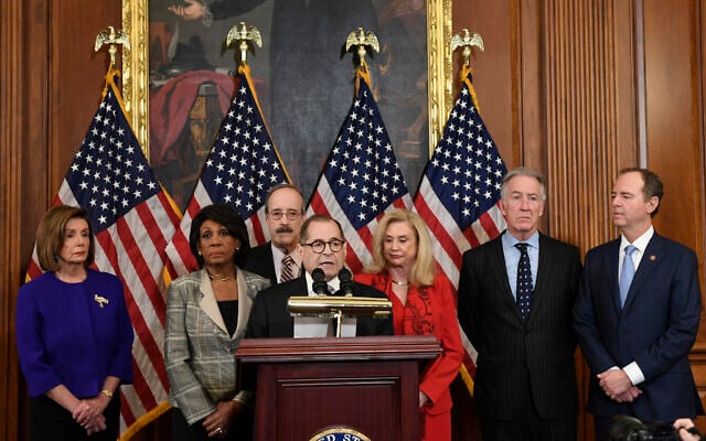 From left, House Speaker Nancy Pelosi, House Financial Services Committee Chair Maxine Waters (California Democrat), House Foreign Affairs Committee Chair Eliot Engel (New York Democrat), House Judiciary Committee Chair Jerrold Nadler (New York Democrat), House Committee on Oversight and Reform Chair Carolyn Maloney (New York Democrat), House Ways and Means Committee Chair Richard Neal (Massachusetts Democrat) and House Permanent Select Committee on Intelligence Chair Adam Schiff (California Democrat) unveil articles of impeachment against US President Donald Trump at a news conference on Capitol Hill in Washington, December 10, 2019. (AP Photo/Susan Walsh)