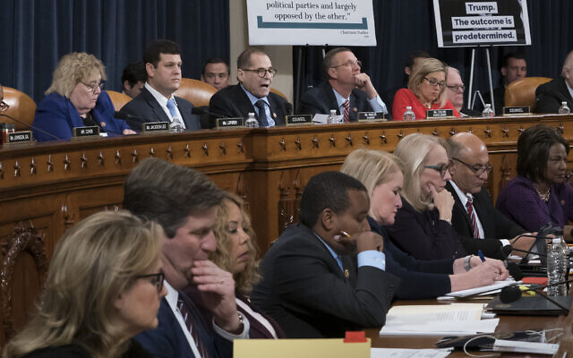 House Judiciary Committee Chairman Jerrold Nadler, D-N.Y., top center, and Rep. Doug Collins, R-Ga., the ranking member, right, makes his opening statement during a markup of the articles of impeachment against President Donald Trump, on Capitol Hill in Washington, Wednesday, Dec. 11, 2019. The Democratic members of the panel are on the bottom row. (AP Photo/J. Scott Applewhite) House Judiciary Committee Chairman Jerrold Nadler, D-N.Y., top center, and Rep. Doug Collins, R-Ga., the ranking member, right, makes his opening statement during a markup of the articles of impeachment against President Donald Trump, on Capitol Hill in Washington, Wednesday, Dec. 11, 2019. The Democratic members of the panel are on the bottom row. (AP Photo/J. Scott Applewhite)