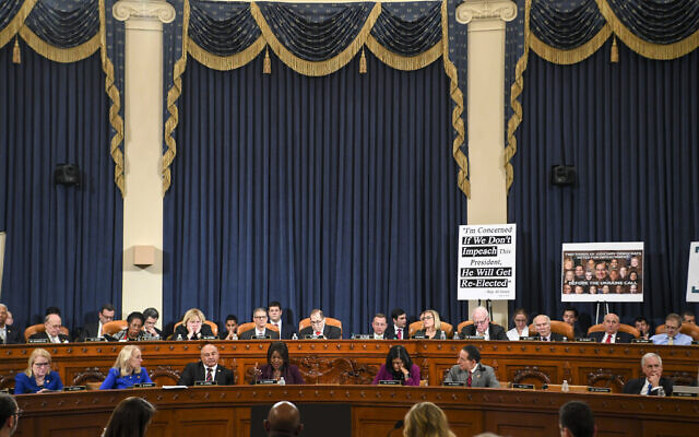 The US House Judiciary Committee at work late into the evening at a markup of the articles of impeachment against US President Donald Trump, on Capitol Hill in Washington, December 12, 2019. (Jonathan Newton/The Washington Post via AP, Pool)