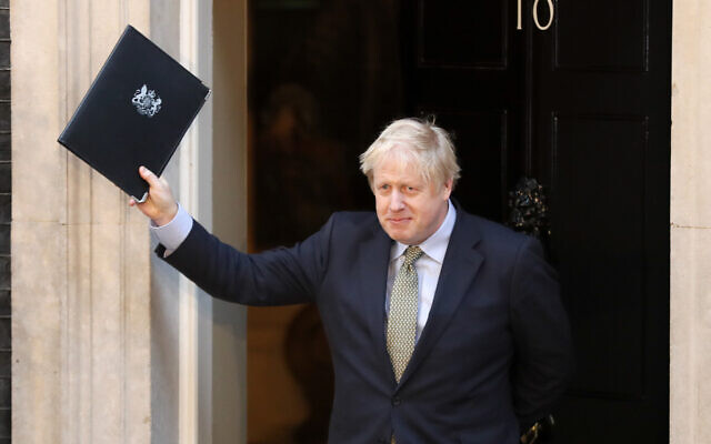 Britain's Prime Minister Boris Johnson waves after addressing the media outside 10 Downing Street in London, Friday, Dec. 13, 2019. Johnson's Conservative Party won a thumping majority of seats in Britain's Parliament.(AP Photo/Frank Augstein)