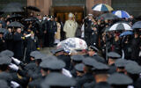 Pallbearers transport the casket of Jersey City Police Detective Joseph Seals in to St. Aeden's church for the funeral services in Jersey City, New Jersey, December 17, 2019. (AP Photo/Seth Wenig)