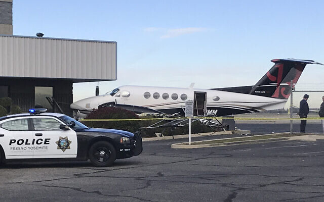 A small plane sits parked after it was crashed into a fence by a 17-year-old girl, December 18, 2019, at the Fresno Yosemite International Airport in Fresno, California (Jim Guy/The Fresno Bee via AP) A small plane sits parked after it was crashed into a fence by a 17-year-old girl, December 18, 2019, at the Fresno Yosemite International Airport in Fresno, California (Jim Guy/The Fresno Bee via AP)