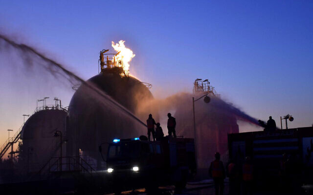 In this photo provided by SANA, Syria's state news agency, workers respond to an attack on Homs oil refinery on December 21, 2019 in Homs, Syria. (SANA via AP) In this photo provided by SANA, Syria's state news agency, workers respond to an attack on Homs oil refinery on December 21, 2019 in Homs, Syria. (SANA via AP)
