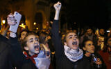 Protesters chant slogans during ongoing protests against the Lebanese political class, in downtown Beirut, Lebanon, December 22, 2019. (AP Photo/Bilal Hussein)