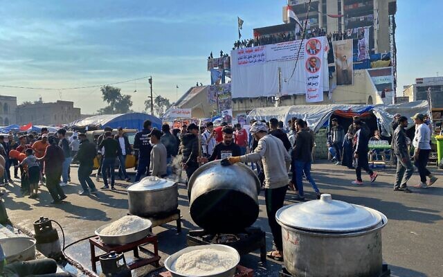 Volunteers prepare free food while anti-government protesters gather in Tahrir Square in Baghdad, Iraq, December 22, 2019. (AP Photo/Khalid Mohammed) Volunteers prepare free food while anti-government protesters gather in Tahrir Square in Baghdad, Iraq, December 22, 2019. (AP Photo/Khalid Mohammed)
