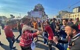 Anti-government protesters dance in Tahrir Square in Baghdad, Iraq, December 22, 2019. (AP Photo/Khalid Mohammed)