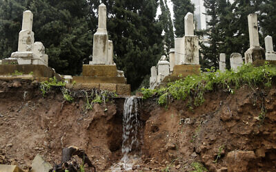 Illustrative: Graves in a Jewish cemetery sit damaged from heavy rains in the Sodeco area of Beirut, Lebanon, December 26, 2019. (AP Photo/Hassan Ammar)