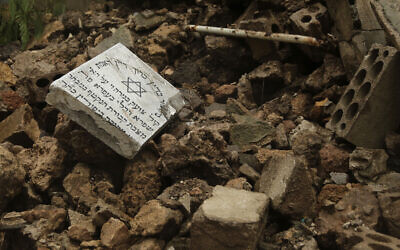 Graves in a Jewish cemetery lie damaged from heavy rains in the Sodeco area of Beirut, Lebanon, December 26, 2019. (AP Photo/Hassan Ammar)