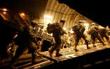 Illustrative: US Army soldiers from 2nd Brigade, 10th Mountain Division board a C-17 aircraft at Baghdad International Airport as they begin their journey to the United States, on July 13, 2010. (Maya Alleruzzo/ AP/ File)