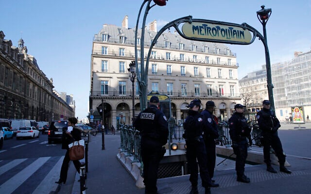 Illustrative: Police officers stand on patrol at a Metro station outside the Louvre museum in Paris, February 3, 2017. (AP Photo/Christophe Ena) Illustrative: Police officers stand on patrol at a Metro station outside the Louvre museum in Paris, February 3, 2017. (AP Photo/Christophe Ena)