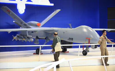Illustrative -- Visitors at the International Defence Industry Fair, IDEF'17, in Istanbul, walk past a Turkish made drone aircraft at a booth, Wednesday, May 10, 2017 (AP Photo/Lefteris Pitarakis)