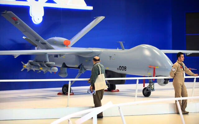 Illustrative -- Visitors at the International Defence Industry Fair, IDEF'17, in Istanbul, walk past a Turkish made drone aircraft at a booth, Wednesday, May 10, 2017 (AP Photo/Lefteris Pitarakis) Illustrative -- Visitors at the International Defence Industry Fair, IDEF'17, in Istanbul, walk past a Turkish made drone aircraft at a booth, Wednesday, May 10, 2017 (AP Photo/Lefteris Pitarakis)