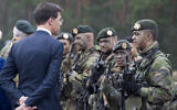 Illustrative: Dutch Prime Minister Mark Rutte speaks with a Dutch soldier who is part of the NATO enhanced forward presence battalion during the visit to the Rukla military base, some 130 km (80 miles) west of the capital Vilnius, Lithuania, August 11, 2017. (AP Photo/Mindaugas Kulbis)