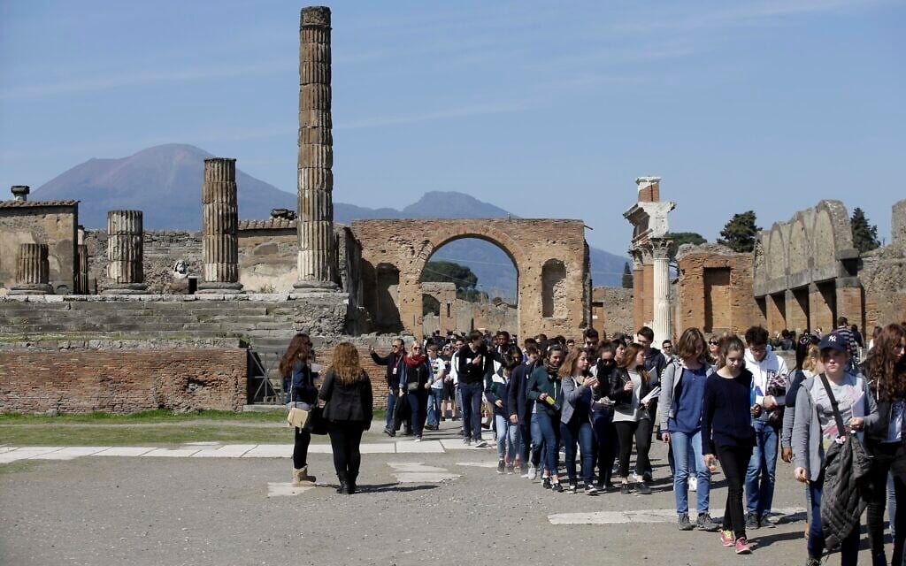 Illustrative: Tourists gather at the Pompeii ancient site near the Villa of Mysteries on the occasion of its presentation to journalists in Pompeii, Italy, Friday, March 20, 2015. (AP Photo/Gregorio Borgia)