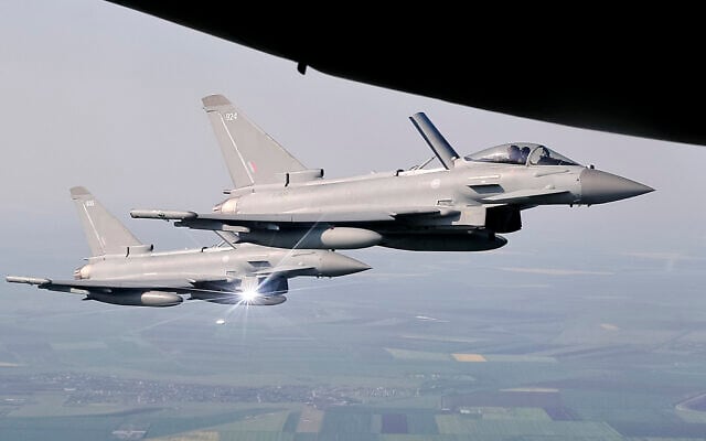 Illustrative: Royal Air Force Eurofighter Typhoon fighter jets escort a transport plane, above eastern Romania, Friday, April 27, 2018. (AP Photo/Vadim Ghirda) Illustrative: Royal Air Force Eurofighter Typhoon fighter jets escort a transport plane, above eastern Romania, Friday, April 27, 2018. (AP Photo/Vadim Ghirda)