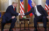 Then-US president Donald Trump, left, and Russian President Vladimir Putin shake hand at the beginning of a meeting at the Presidential Palace in Helsinki, Finland, July 16, 2018. (AP Photo/Pablo Martinez Monsivais)