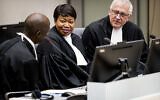 Former Prosecutor Fatou Bensouda, center, and Deputy Prosecutor James Stewart, right, attend the first audience with the chief of Central African Republic's soccer federation Patrice-Edouard Ngaissona at the International Criminal Court (ICC) in The Hague, the Netherlands on January 25, 2019. (Koen Van Well/Pool photo via AP)