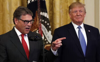 President Donald Trump listens as Energy Secretary Rick Perry speaks during an event about the environment in the East Room of the White House, Monday, July 8, 2019, in Washington. (AP Photo/Alex Brandon)