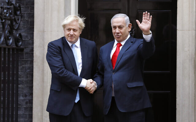 British Prime Minister Boris Johnson, left, welcomes Israel's then-prime minister Benjamin Netanyahu outside Downing Street in London, September 5, 2019. (AP Photo/Alastair Grant) British Prime Minister Boris Johnson, left, welcomes Israel's then-prime minister Benjamin Netanyahu outside Downing Street in London, September 5, 2019. (AP Photo/Alastair Grant)