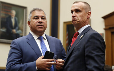 Corey Lewandowski, the former campaign manager for US President Donald Trump, stands with David Bossie, as he arrives to testify to the House Judiciary Committee, September 17, 2019, in Washington. (AP Photo/Jacquelyn Martin)