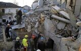 Rescuers try to free a man from a collapsed building, after a magnitude 6.4 earthquake in Thumane, western Albania, November 26, 2019. (AP Photo/Visar Kryeziu)