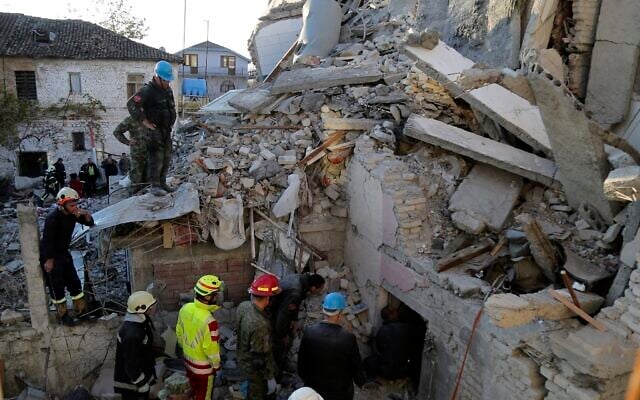 Rescuers try to free a man from a collapsed building, after a magnitude 6.4 earthquake in Thumane, western Albania, November 26, 2019. (AP Photo/Visar Kryeziu) Rescuers try to free a man from a collapsed building, after a magnitude 6.4 earthquake in Thumane, western Albania, November 26, 2019. (AP Photo/Visar Kryeziu)
